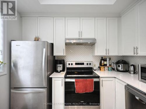 #338 - 349 Wheat Boom Drive, Oakville, ON - Indoor Photo Showing Kitchen With Stainless Steel Kitchen