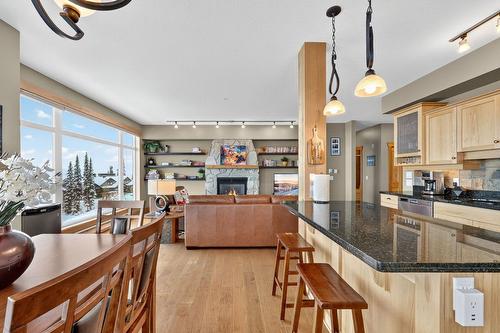 203-315 Whitehorse Lane, Big White, BC - Indoor Photo Showing Kitchen With Fireplace With Upgraded Kitchen