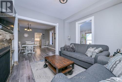 Living Room open to dining room - 681141 260 Side Road, Melancthon, ON - Indoor Photo Showing Living Room With Fireplace