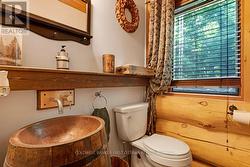 Powder room wood barrel vanity with copper sink - 