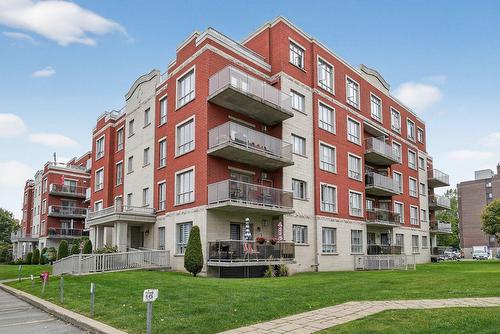 Façade - 401-110 Rue Barnett, Dollard-Des-Ormeaux, QC - Outdoor