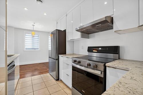 Cuisine - 401-110 Rue Barnett, Dollard-Des-Ormeaux, QC - Indoor Photo Showing Kitchen