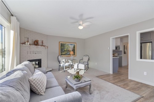 2-2034 Weiler Ave, Sidney, BC - Indoor Photo Showing Living Room With Fireplace