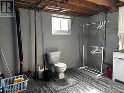 2pc bathroom (located in laundry area) - 