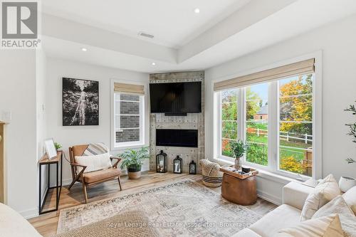 7 - 383 Dundas Street E, Hamilton, ON - Indoor Photo Showing Living Room With Fireplace