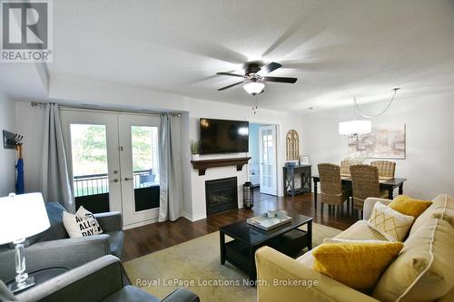 102 - 1 Brandy Lane Drive, Collingwood, ON - Indoor Photo Showing Living Room With Fireplace