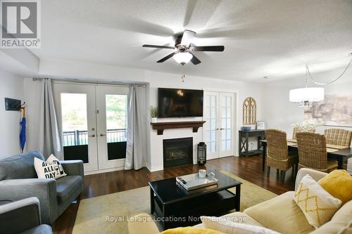 102 - 1 Brandy Lane Drive, Collingwood, ON - Indoor Photo Showing Living Room With Fireplace