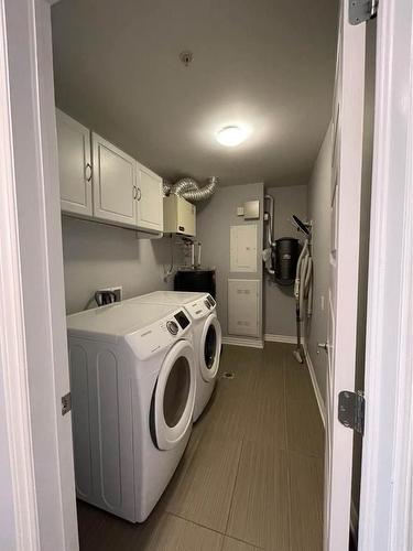 Salle de lavage - 305-3745 Av. Jean-Béraud, Laval (Chomedey), QC - Indoor Photo Showing Laundry Room