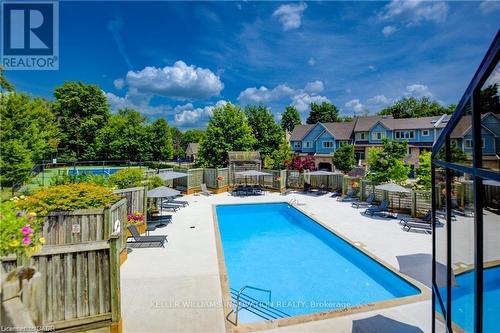 56 - 225 Benjamin Road, Waterloo, ON - Outdoor With In Ground Pool