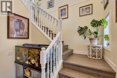 Stairs by front entrance - 393 Mccarren Avenue, Kelowna, BC - Indoor Photo Showing Other Room