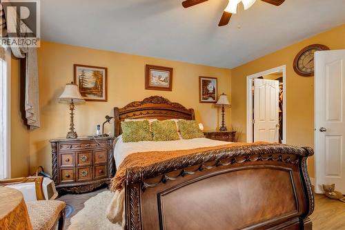 Primary bedroom with a 5 piece ensuite & walk in closet - 393 Mccarren Avenue, Kelowna, BC - Indoor Photo Showing Bedroom