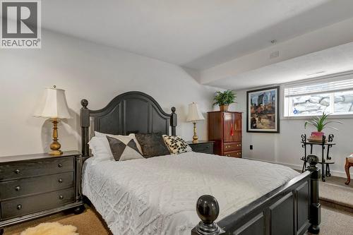 First bedroom in suite - 393 Mccarren Avenue, Kelowna, BC - Indoor Photo Showing Bedroom