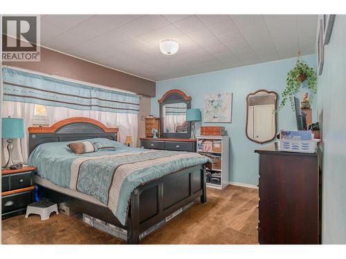 8329 Highway 3B, Trail, BC - Indoor Photo Showing Bedroom