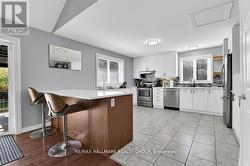 Quartz counter top and breakfast bar. - 