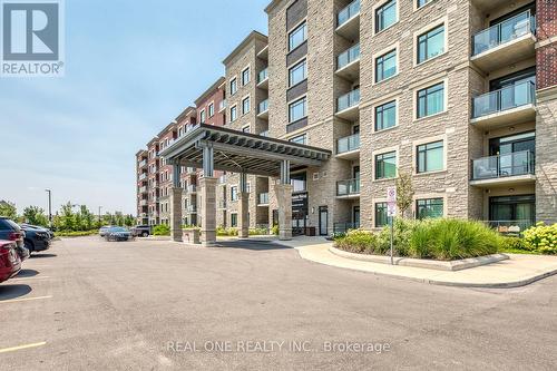 101 - 830 Megson Terrace, Milton, ON - Outdoor With Balcony With Facade