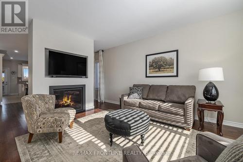 7 Senators Gate Drive, Perth, ON - Indoor Photo Showing Living Room With Fireplace