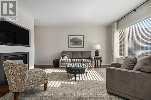 7 Senators Gate Drive, Perth, ON - Indoor Photo Showing Living Room With Fireplace
