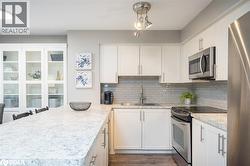 white kitchenwith subway tile backsplash - 