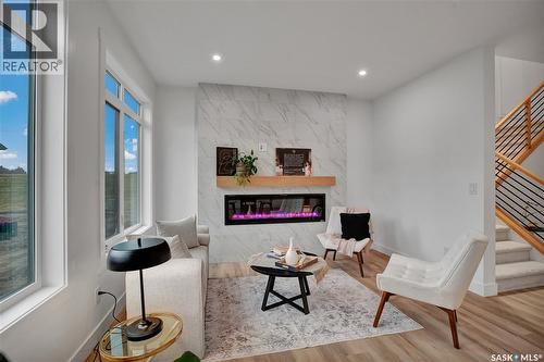 911 Traeger Manor, Saskatoon, SK - Indoor Photo Showing Living Room With Fireplace
