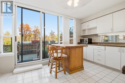 Kitchen with walk out to patio - 102 - 3 Towering Heights Boulevard, St. Catharines (Glendale/Glenridge), ON - Indoor Photo Showing Kitchen