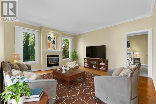 Staged image - living room with fireplace - 157 Loretta Drive, Niagara-On-The-Lake (Virgil), ON - Indoor Photo Showing Living Room With Fireplace