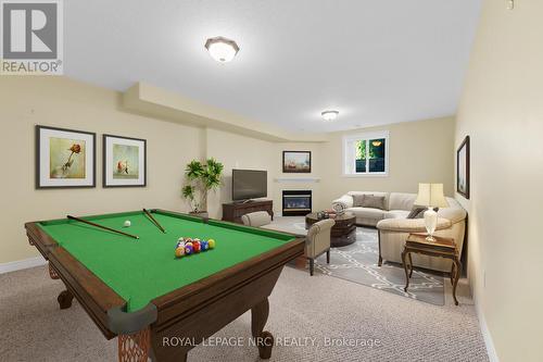 Staged photo - rec room with gas fireplace - 157 Loretta Drive, Niagara-On-The-Lake (Virgil), ON - Indoor Photo Showing Other Room