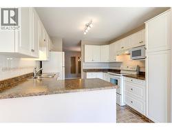 Kitchen with plenty of cabinets and counter space - 