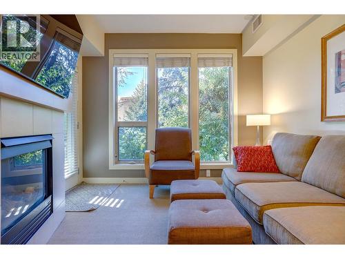 7343 Okanagan Landing Road Unit# 1114, Vernon, BC - Indoor Photo Showing Living Room With Fireplace
