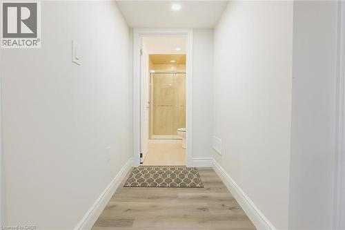 Hallway with light wood-type flooring and recessed lighting - 19 Sassafras Street Unit# Lower, Kitchener, ON - Indoor Photo Showing Other Room