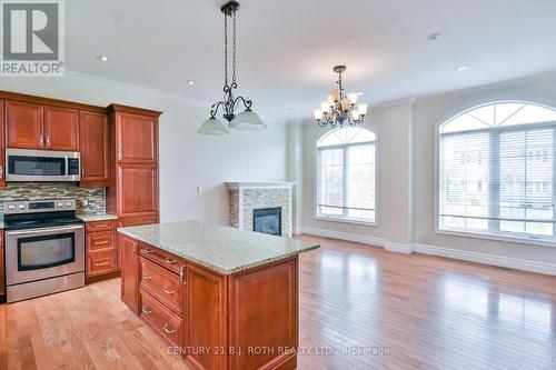 16 Gray Lane, Barrie, ON - Indoor Photo Showing Kitchen With Fireplace