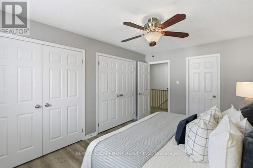 His and hers closets in primary bedroom - 113 Thornlodge Drive, Hamilton, ON - Indoor Photo Showing Bedroom