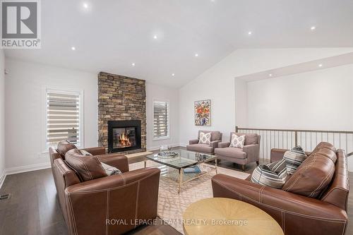 212 Cabrelle Place, Ottawa, ON - Indoor Photo Showing Living Room With Fireplace