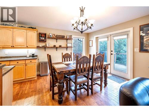 dining room with french doors to large deck - 1701 Mountain View Avenue, Lumby, BC - Indoor Photo Showing Dining Room
