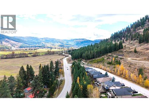 home with the light coloured roof is 1701 Mountain View Ave - 1701 Mountain View Avenue, Lumby, BC - Outdoor With View