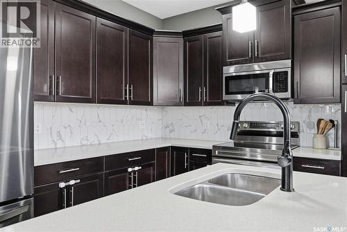 17 600 Maple Crescent, Warman, SK - Indoor Photo Showing Kitchen With Double Sink