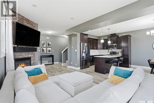 17 600 Maple Crescent, Warman, SK - Indoor Photo Showing Living Room With Fireplace