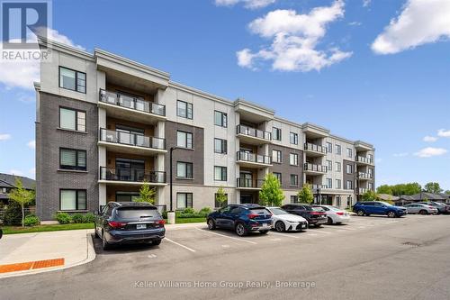 102 - 99A Farley Road, Centre Wellington (Fergus), ON - Outdoor With Balcony With Facade