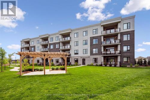 102 - 99A Farley Road, Centre Wellington (Fergus), ON - Outdoor With Balcony With Facade