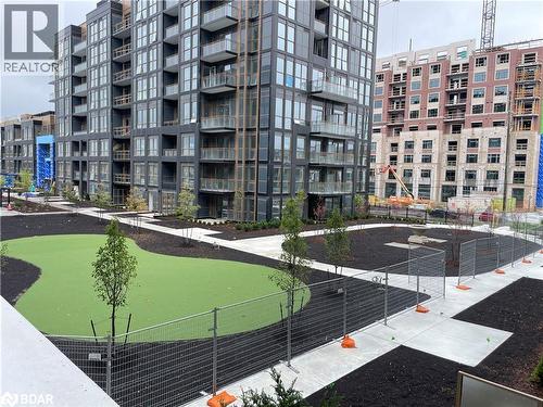 Putting Green Outdoor courtyard - 2343 Khalsa Gate Unit# 201, Oakville, ON - Outdoor With Facade