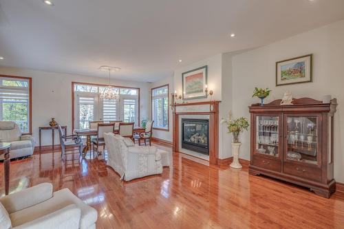 Dining room - 2 Place De Montmedy, Lorraine, QC - Indoor Photo Showing Living Room With Fireplace