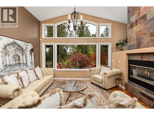 3929 Gallaghers Circle, Kelowna, BC - Indoor Photo Showing Living Room With Fireplace