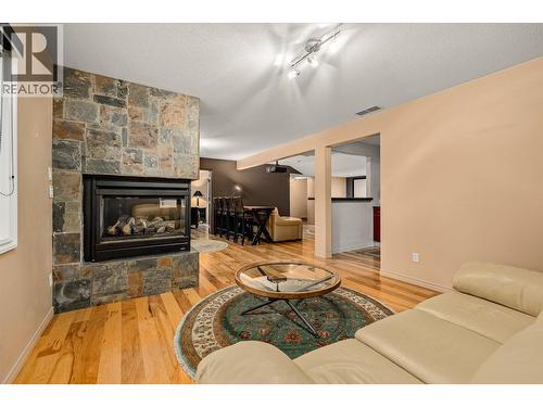 3929 Gallaghers Circle, Kelowna, BC - Indoor Photo Showing Living Room With Fireplace