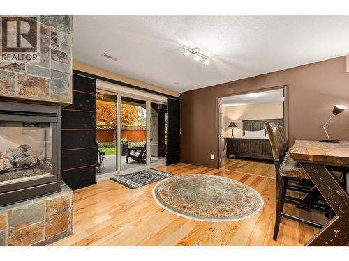 3929 Gallaghers Circle, Kelowna, BC - Indoor Photo Showing Other Room With Fireplace