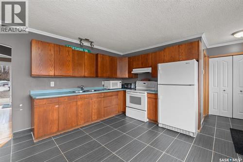 277 Carwin Park Drive, Lakeland Rm No. 521, SK - Indoor Photo Showing Kitchen With Double Sink