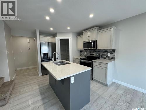 4409 E Keller Avenue, Regina, SK - Indoor Photo Showing Kitchen With Double Sink