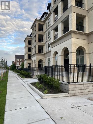 106 - 101 Cathedral High Street, Markham, ON - Outdoor With Facade