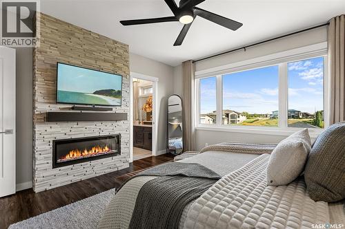 127 Iron Bridge Drive, Moose Jaw, SK - Indoor Photo Showing Bedroom With Fireplace