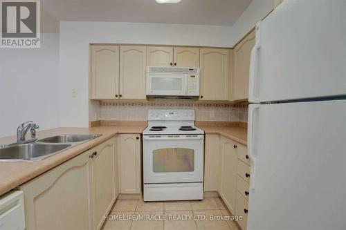 1509 - 30 Grand Trunk Crescent, Toronto, ON - Indoor Photo Showing Kitchen With Double Sink
