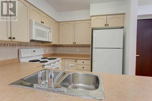 1509 - 30 Grand Trunk Crescent, Toronto, ON - Indoor Photo Showing Kitchen With Double Sink
