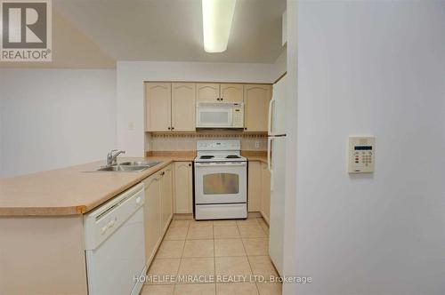 1509 - 30 Grand Trunk Crescent, Toronto, ON - Indoor Photo Showing Kitchen With Double Sink